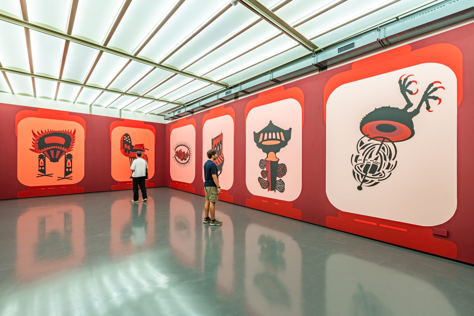 Mona Marzouk’s murals across the exhibition walls.