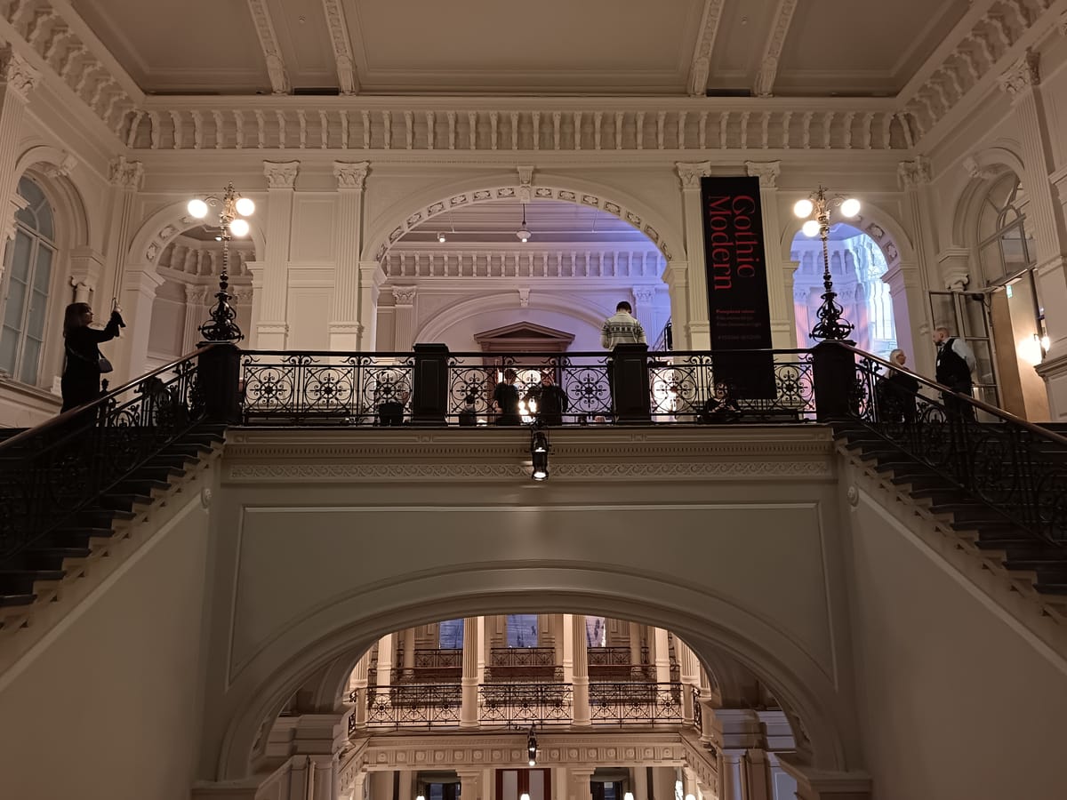 Entrance hall of Ateneum Art Museum during Gothic Modern at Ateneum, with statue leading visitors into the exhibition