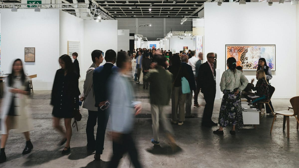 Collectors and galleries navigating an art fair environment where visibility, pacing, and positioning are carefully managed.