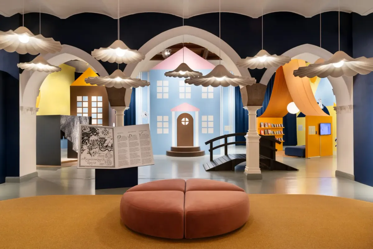 A brightly colored exhibition space at Helsinki’s Architecture & Design Museum, featuring Moomin-themed architectural installations.
