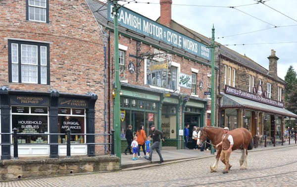 Visitors explore Beamish Living Museum’s recreated 1950s town with actors in period costumes