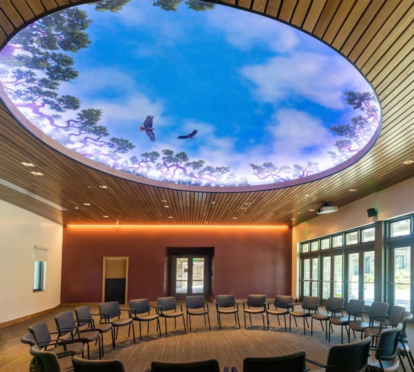 Interior of the Santa Ynez Chumash Museum and Cultural Center featuring exhibits, digital displays, and educational installations