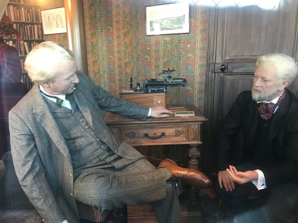 Wax figures of Gustave Eiffel, Thomas Edison, and Claire Eiffel inside Gustave Eiffel’s restored summit office at the Eiffel Tower