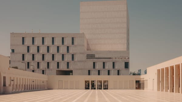 Modern cultural building in Msheireb Downtown Doha, featuring geometric stone facades and open public walkways.