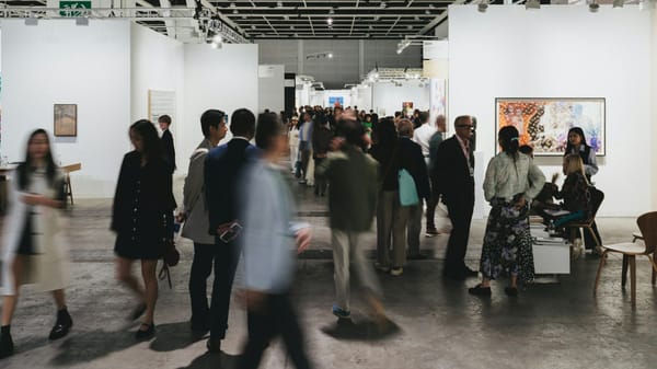Collectors and galleries navigating an art fair environment where visibility, pacing, and positioning are carefully managed.